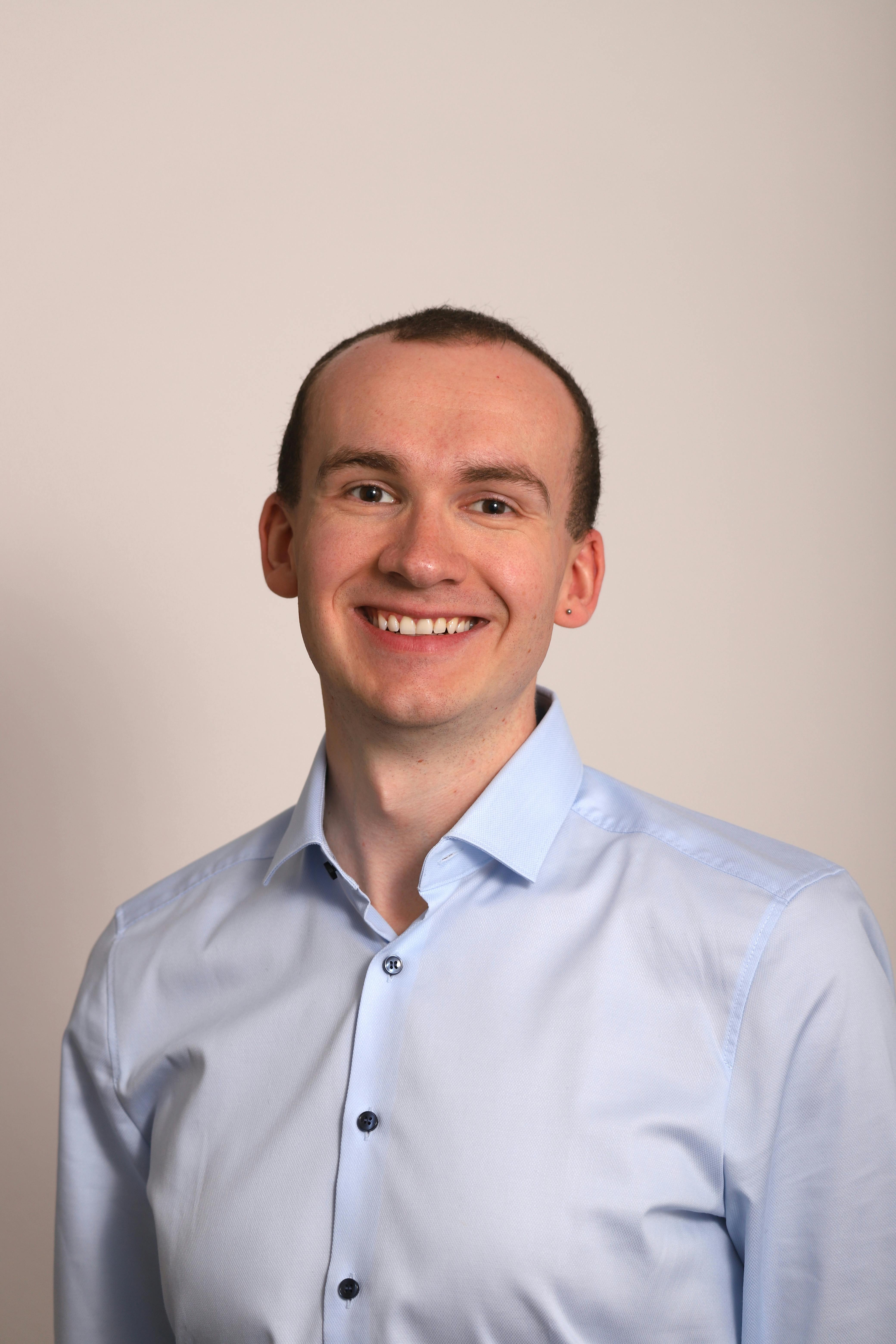 Professional headshot of Marcus Hofmann